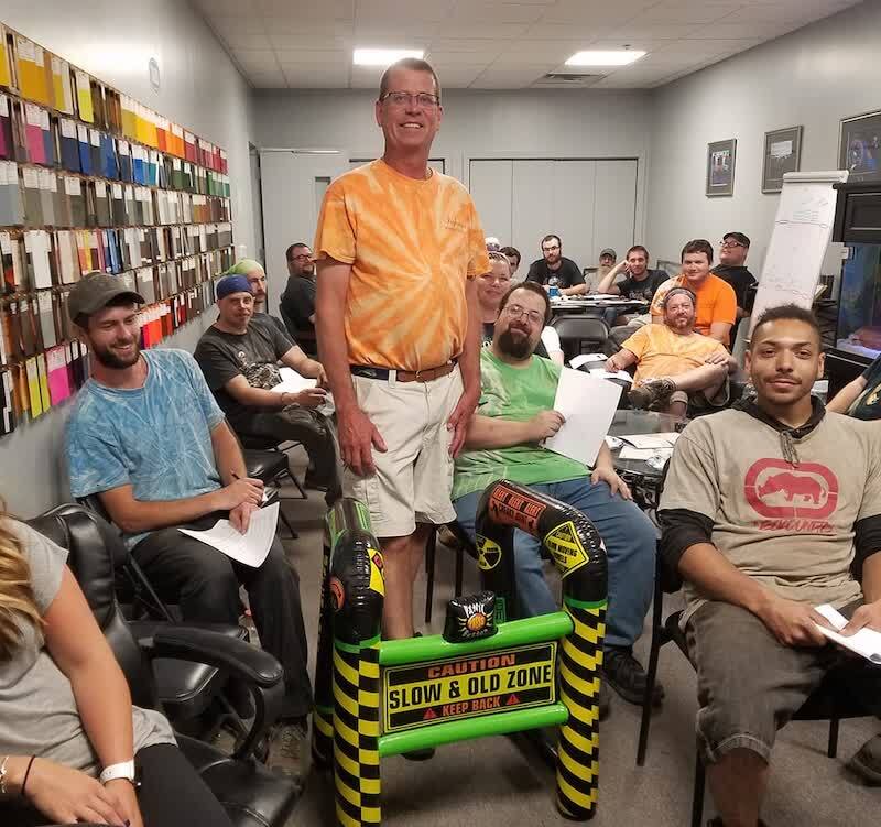 Kyle Ingham gets a gift from his team.