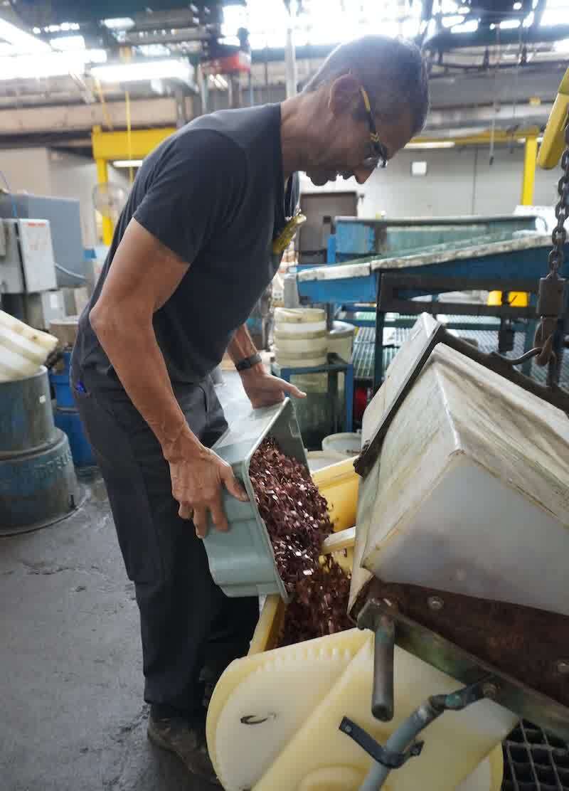 Terry Willis loads parts.