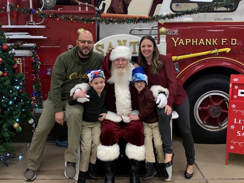 Chrissy Pullara with husband, Joe, and her two children make requests with St. Nick.