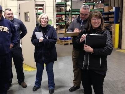 Mindy Kaiser, far right, gets ready for a quality meeting with her team at Hohman Plating.
