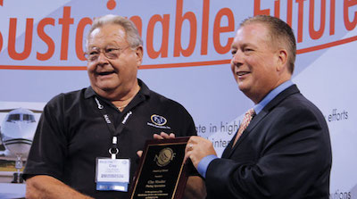Clay Mueller received the NASF Award of Merit from Rick Delaware for SWF.