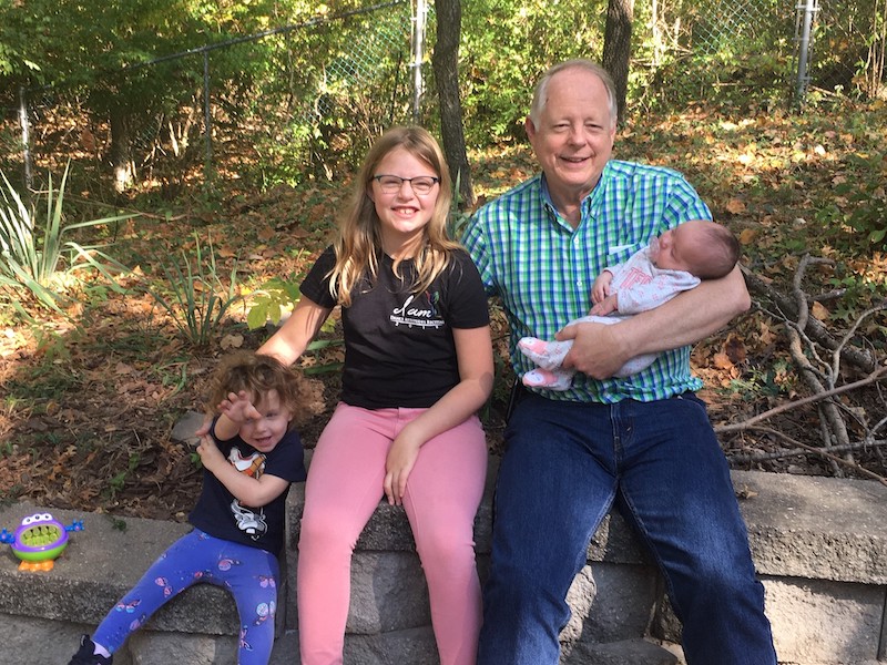 Milt with his three granddaughters.