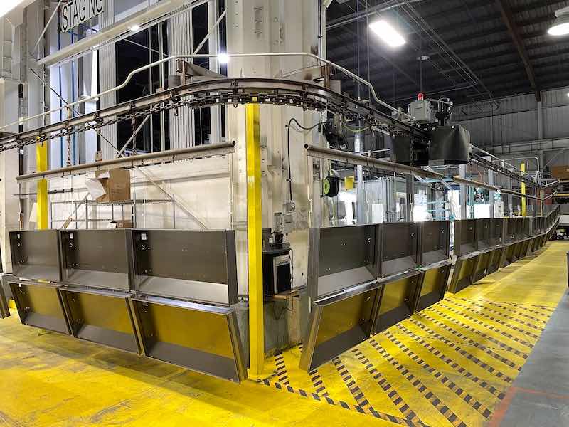 The shop's newest conveyor system runs 14 feet a minute.