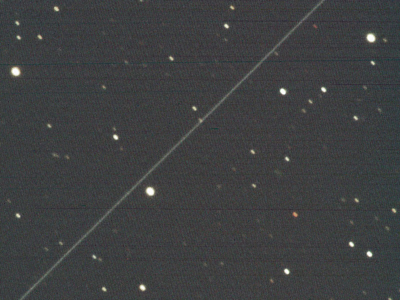The trail of a Starlink satellite (the line from upper right to lower left) captured by the Murikabushi Telescope on April 10, 2020. (Credit: NAOJ)