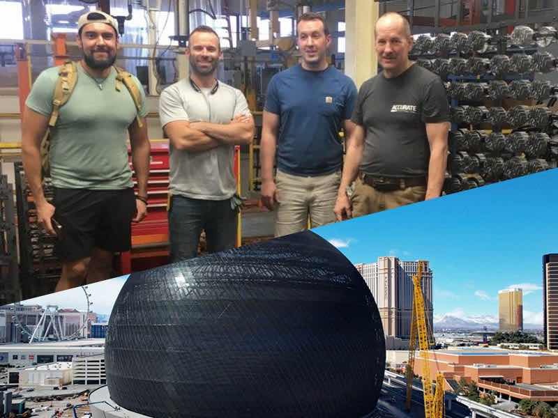 5 men standing plus photo of sphere