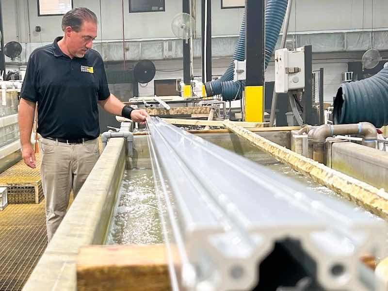 man looking at plating line
