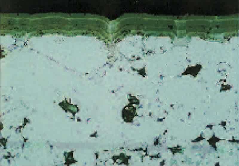 This is a cross-section of the same unplated part as in the photo above, taken from an area away from the notch (400X). Note that the surface is very smooth and relatively pore-free.