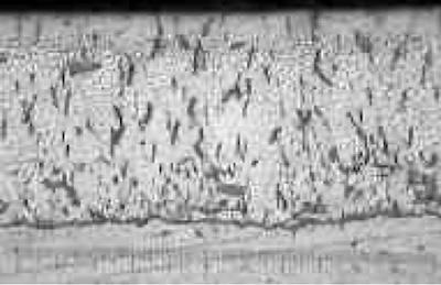 Cross section and crack pattern of a normal hard chromium deposit (photomicrograph at 400x).