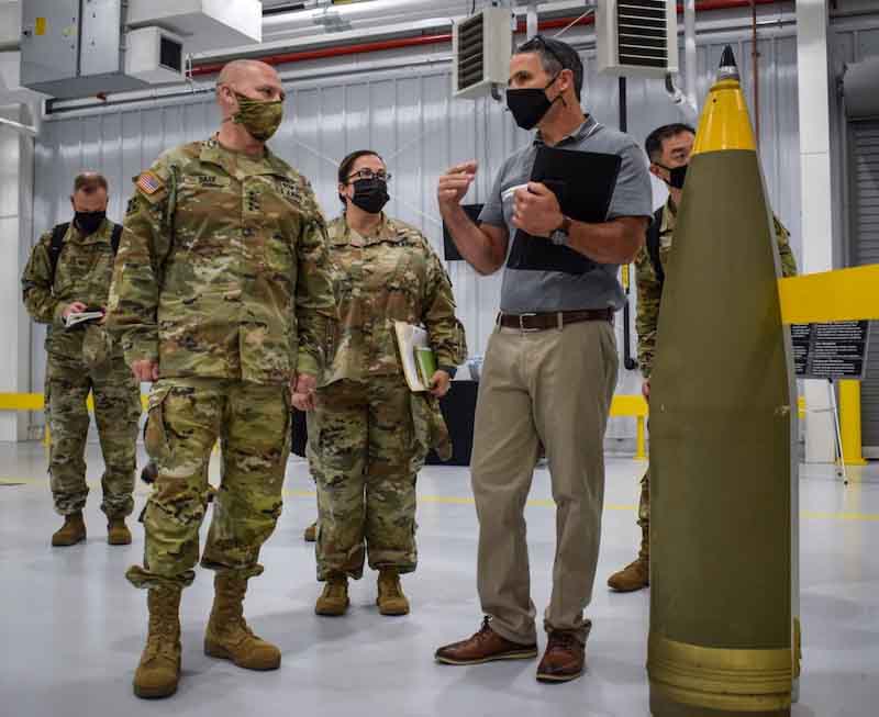 Greg Edwards, CAAA supervisory supply management specialist, shows Gen. Ed Daly, commanding general of U.S. Army Materiel Command, and a group of Army leaders around Crane Armyâs new receiving building. The new facility will improve CAAAâs capacity to receive, process and store munitions and explosives due to having a dedicated, centralized space to unpack and inspect shipments upon arrival to the installation. By preventing the double handling of shipments, CAAA will save taxpayer money, time and effort for the workforce. | Photo by Lindsay Grant, Crane Army Ammunition Activity Public Affairs Office (Lindsay Grant)