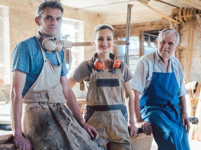 3 people standing in a shop