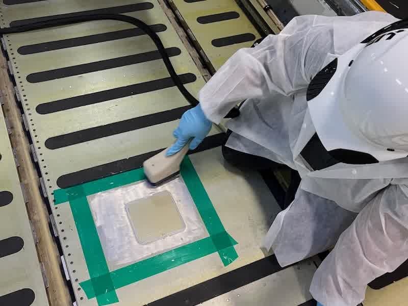 Figure 2. Volta performing localized sulfuric acid anodizing on the C-5 cargo floor