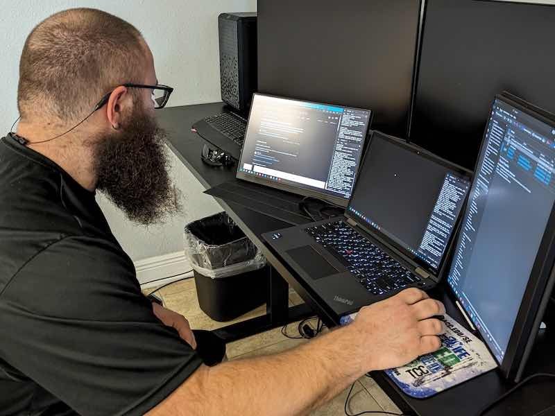 Anthony Nagy works on the IT system at Freedom Metal Finishing, which spent over $400,000 to upgrade its systems to meet security requirements.