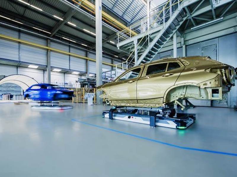 car being painted in a factory