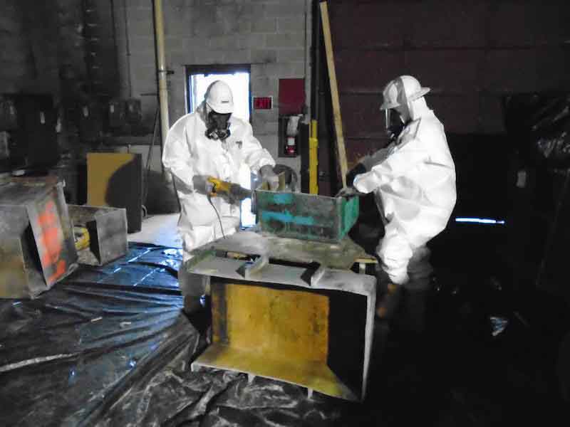 men in suits cleaning plating shop