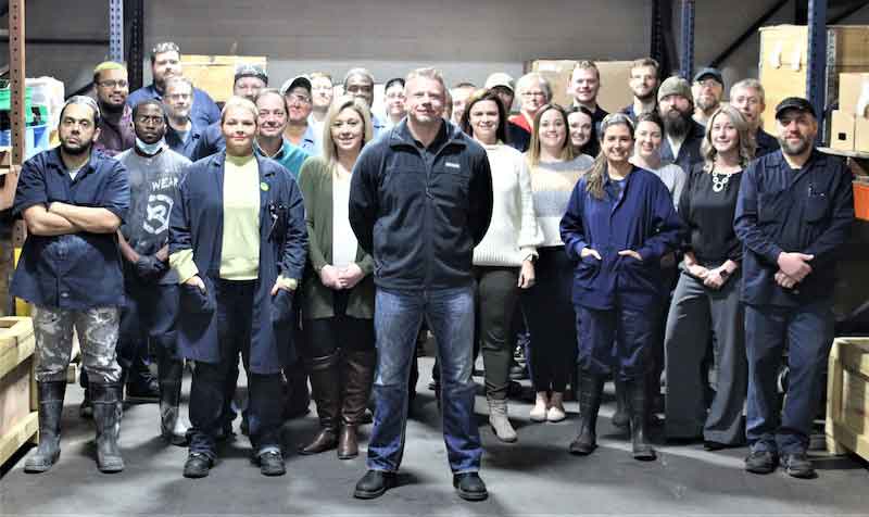 The Klein Plating Works team stand behind President Joe Dudenhoeffer.