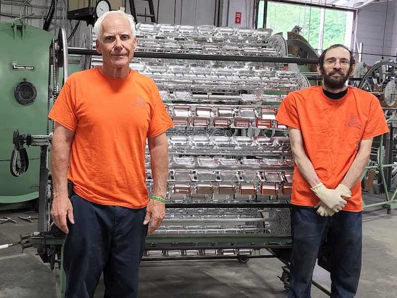 Bill Knape and Daniel Wilson in front of coater.