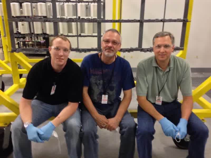 Barnstead and his Apple cohorts on a finishing test line working on a solution.
