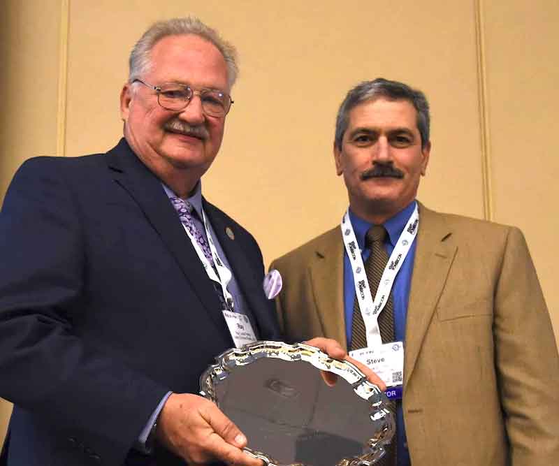 Ray Lucas, left, received an award from then-NASF President Steve Brown.