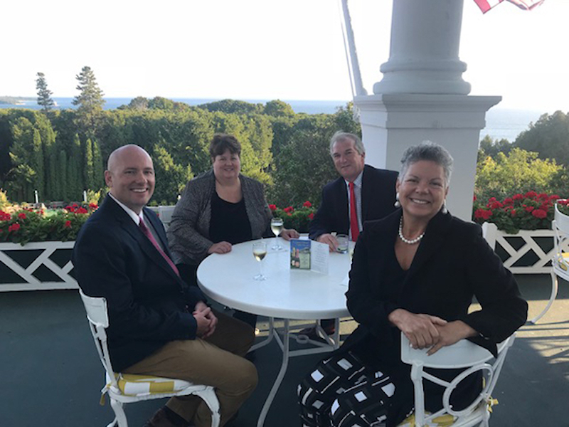 four people sitting at a table