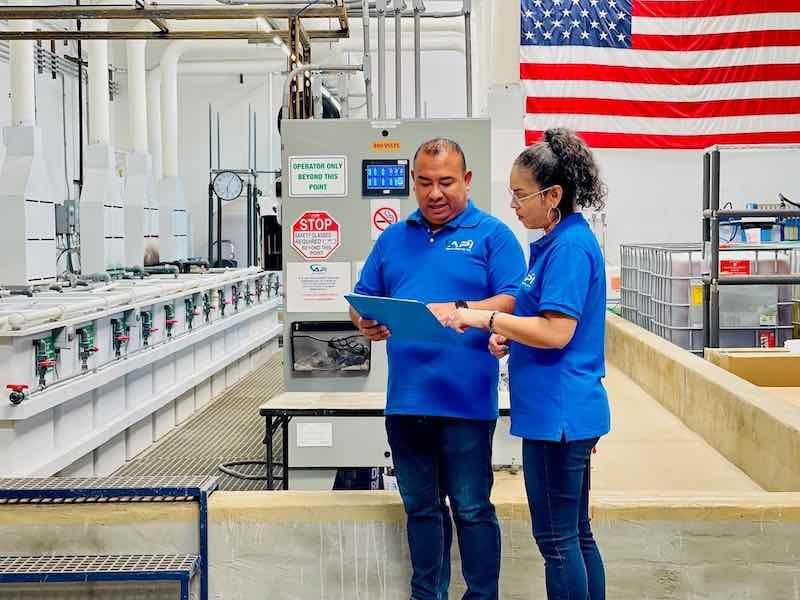 Doug Orantes and his wife, Loida, look over job orders.