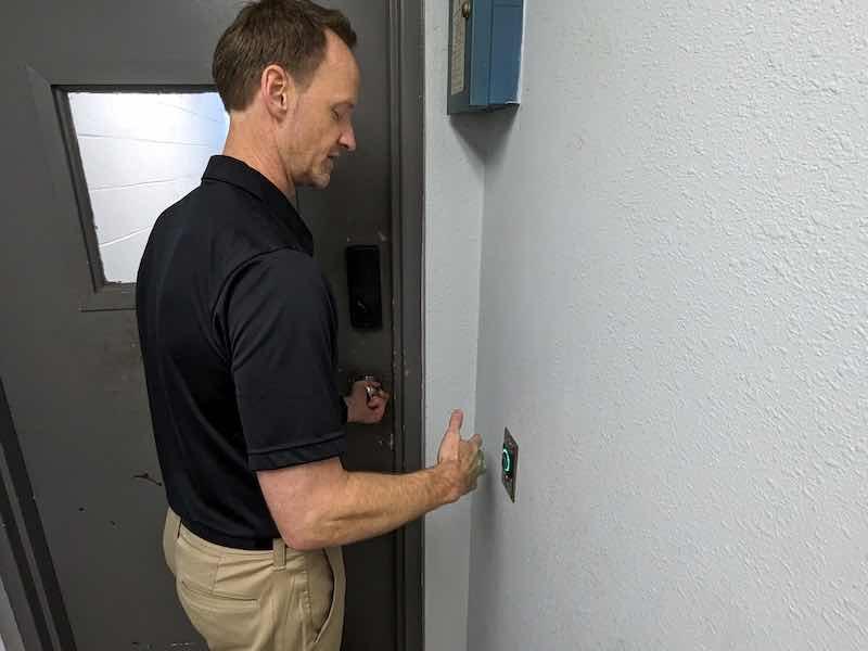 man entering door