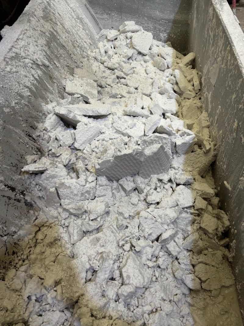 The sludge drier deposits the fine powder below for waste. BASF/Chemetall has helped Tower Extrusions reduce their waste by 75%.
