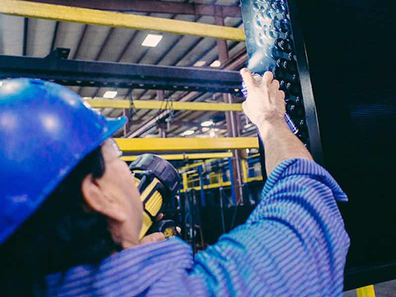 man spraying coatings