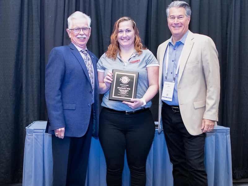 3 people getting an award