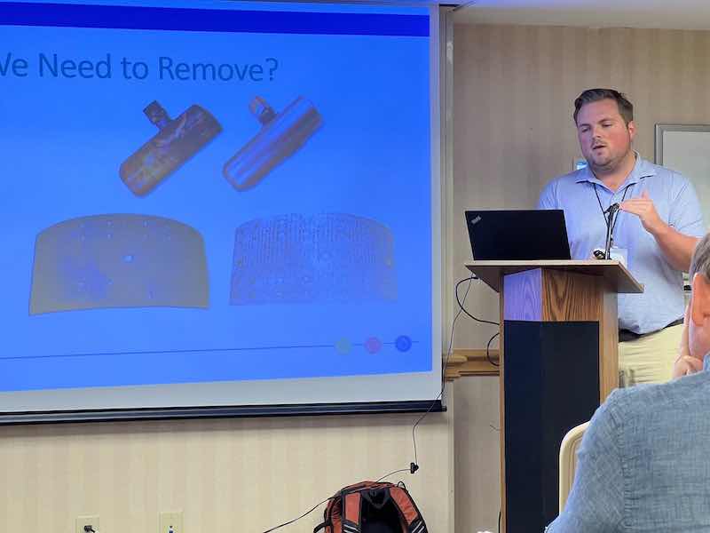 man speaking at lecture stand