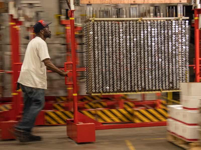man pushing parts