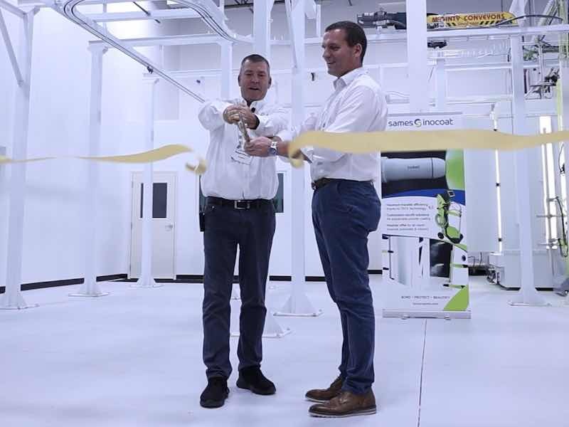 Regan Murray, President of Sames North America Inc., and Cedric Perres, CEO of Sames, cut the ribbon to open the lab.