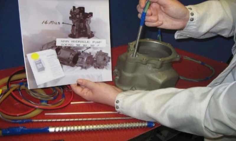 Figure 13 - Hard anodize (8-14 mil) selectively applied in the bore holes of a 356 alloy hydraulic pump.