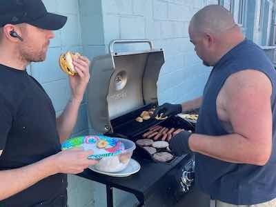 Supervisors Carl Funk and Leroy Milburn help grill for the staff, a usual site at Specialty Plating.