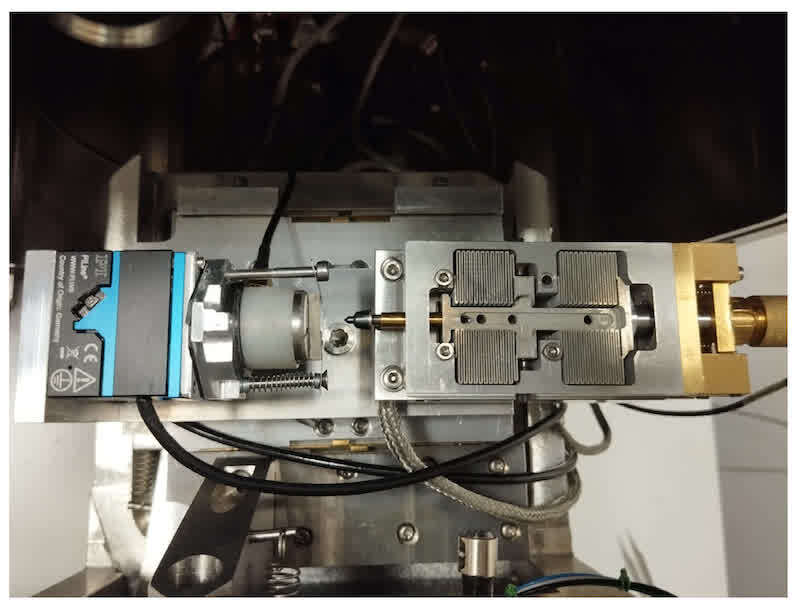 Figure 2. Mobile nanoindenter integrated into the SEM chamber used for the in situ cross-sectional nanoindentation measurements.