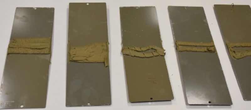 Fig. 8 Ecoated and PVC sealed aluminium and galvanized steel testing samples after corrosion test.
