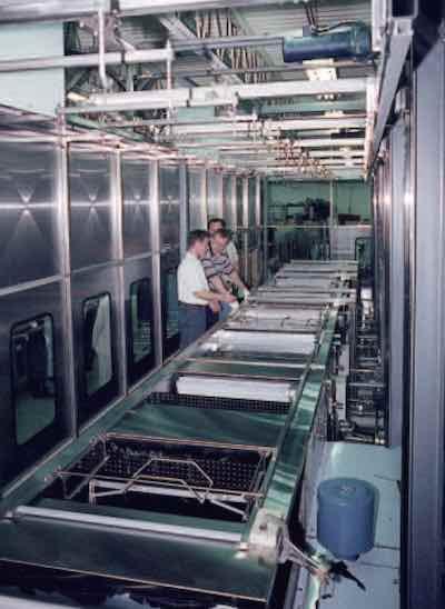 This fully enclosed, automated ultrasonic cleaning system was designed especially for processing brass components. (Photo courtesy of CAE Blackstone.)