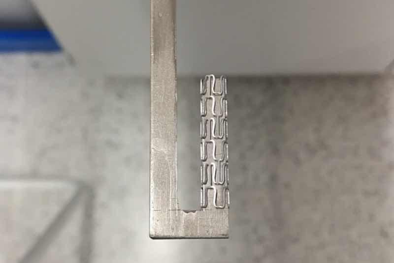 Fig. 4. Stent inserted on a titanium hook prior to the PEO process.