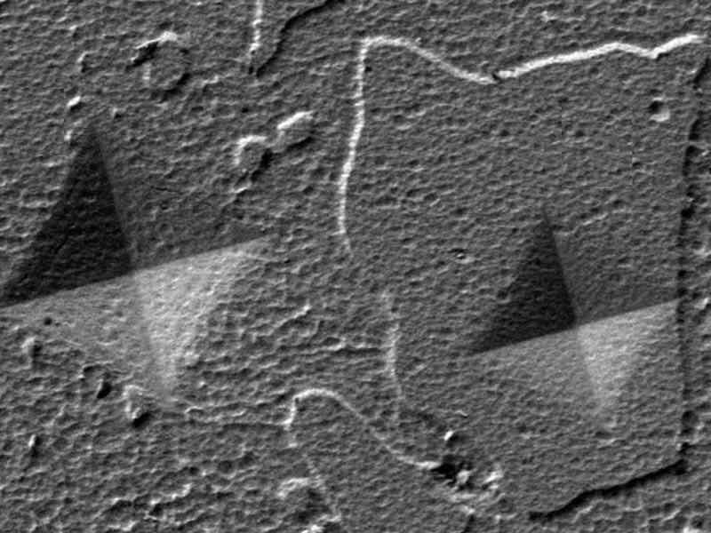 Top view SEM images of indents at 1000 mN load on TiAlN sputter-deposited